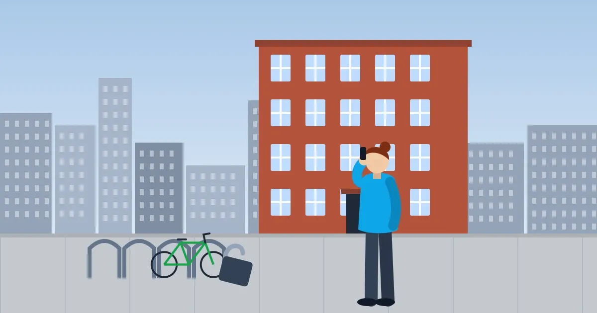 Illustration of a renter finding a cut bike lock on an empty rack outside an apartment building