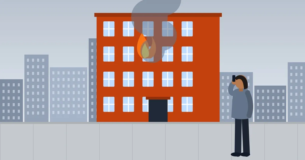 Illustration of smoke and flames coming from an apartment window while a tenant watches from the street