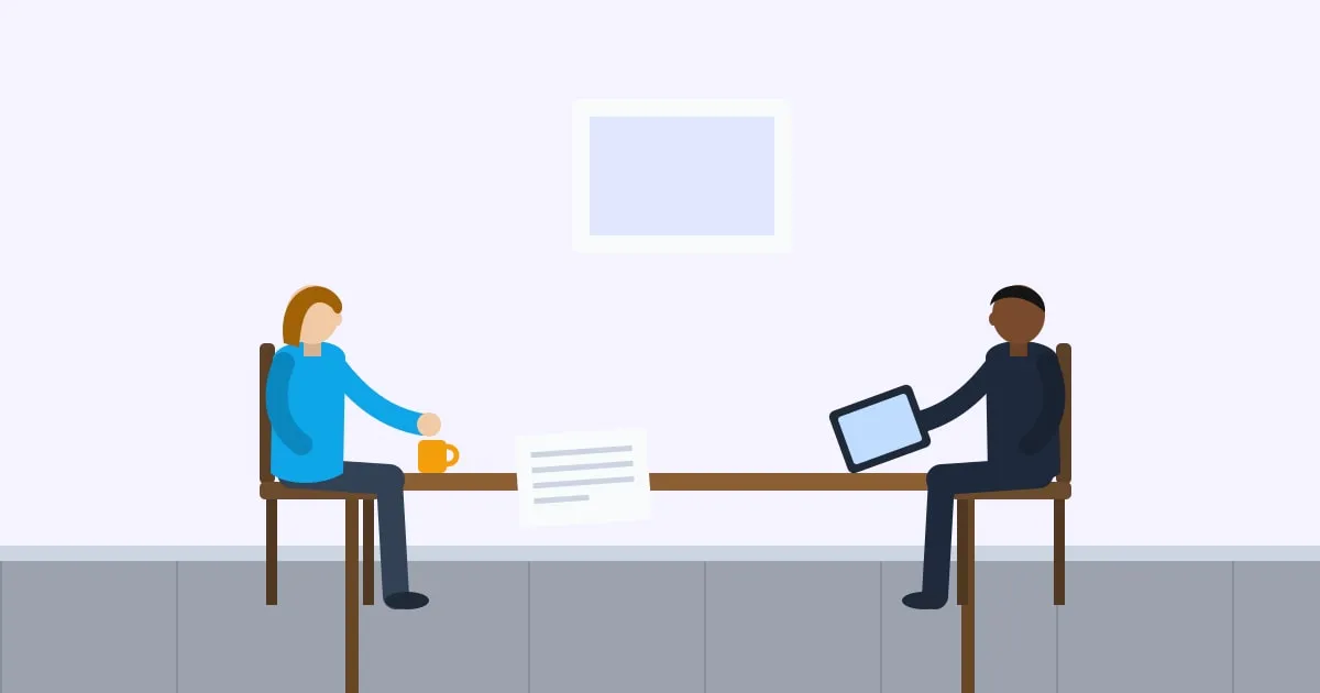 Illustration of an insurance broker reviewing options on a tablet with a client across a desk